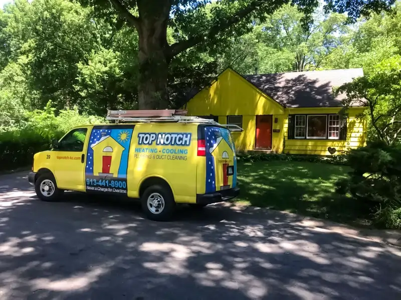 Top Notch Heating, Cooling & Plumbing yellow van and house in Lenexa KS