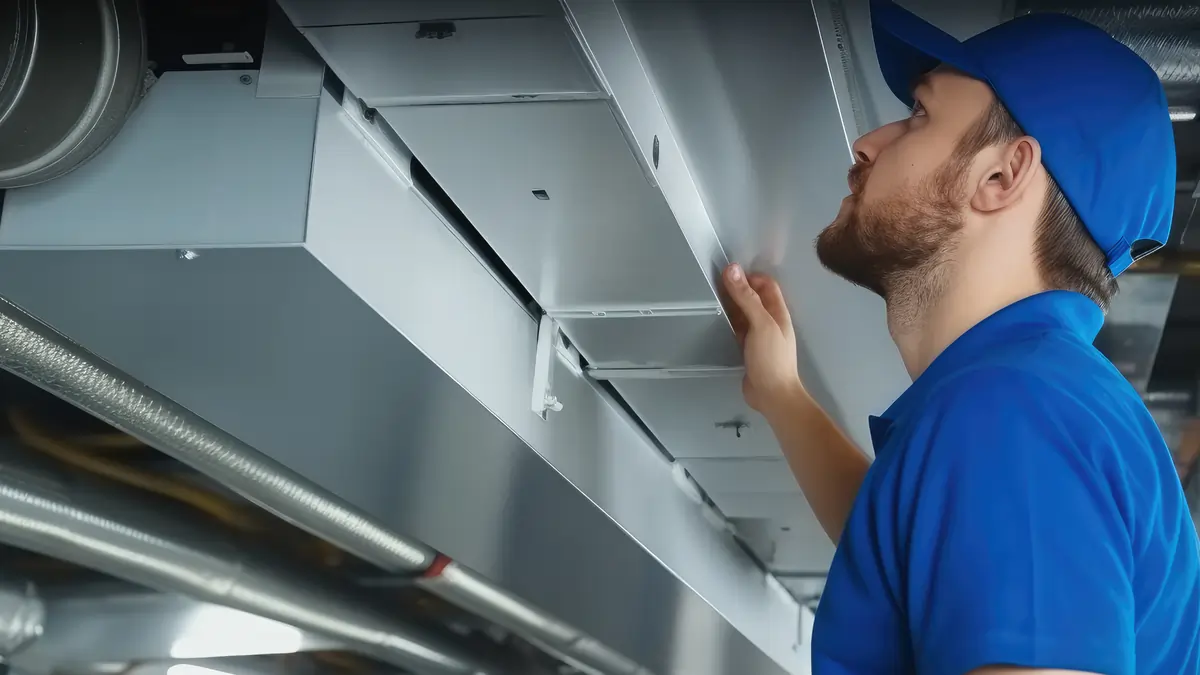 Tech check air duct in home Top Notch Heating Cooling and Plumbing