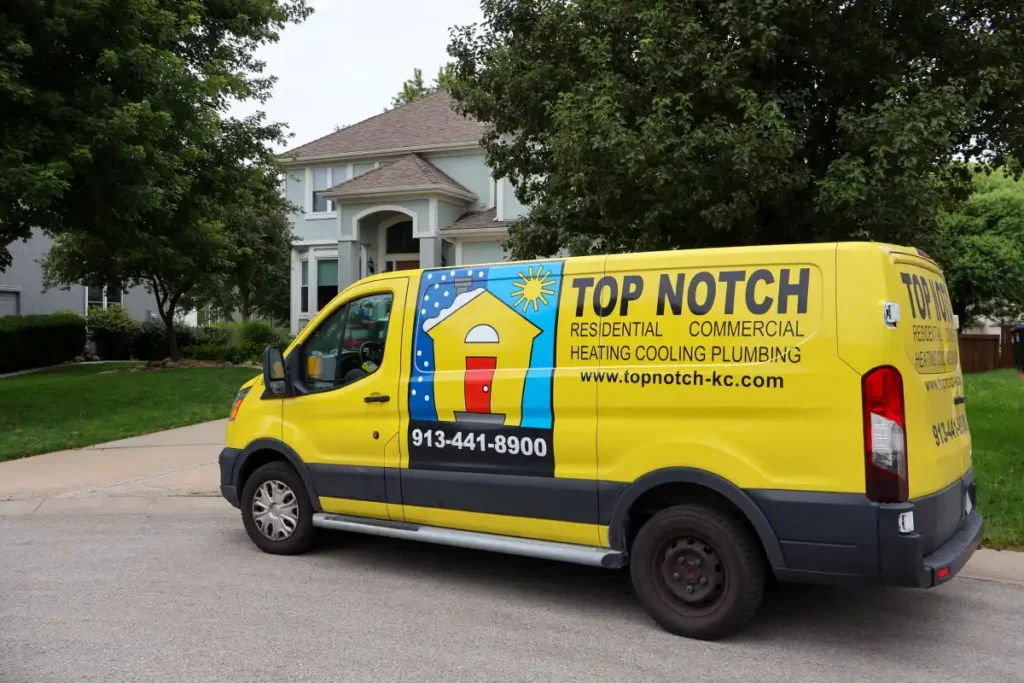Top Notch Heating, Cooling & Plumbing van outside Shawnee KS home