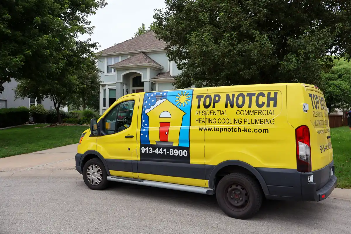Top Notch Heating, Cooling & Plumbing van outside Shawnee KS home